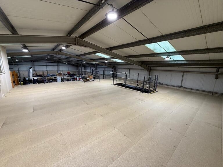Completed mezzanine floor providing additional storage space inside a commercial warehouse in Chesterfield.